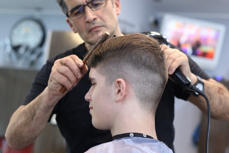 Barber working on a beard